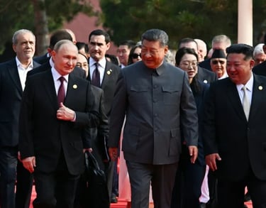 a group of men in suits and ties walking down a red carpet