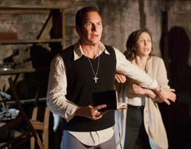 a man and woman standing in a room