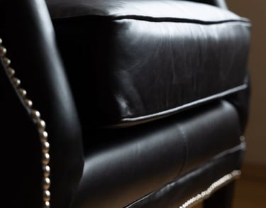black leather armchair with decorative nails