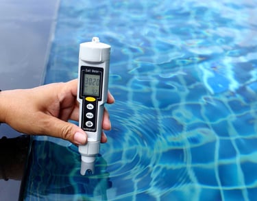 Digital water testing device checking pool chemical levels—part of Piscus Pools’ precise maintenance service.
