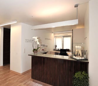 a kitchen with a wooden floor and a planter