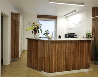 a reception table with a vase of flowers