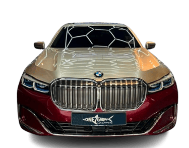 BMW 7 Series wrapped in gold and maroon two-tone vinyl finish