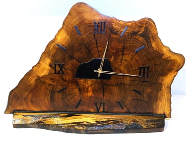 Edged wooden slab clock for table or shelf.