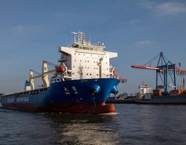 a large ship is docked at a dock