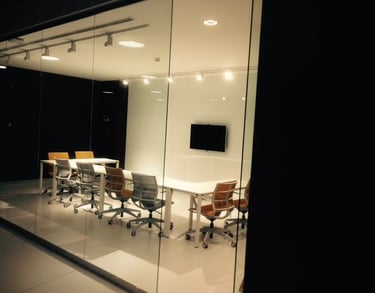 Modern open-plan office featuring recessed linear LED lighting with low-glare optics for employee pr