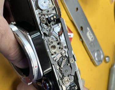 Olympus OM 1 being repaired