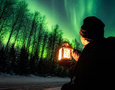 Solo traveler holding a lantern while watching the Northern Lights during an Aurora Hunt with Local Guide Timo in Rovaniemi