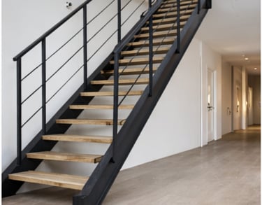 Escalera metálica con barandilla fabricada en Vigo