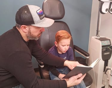 Pediatric Eye Exam at Edge Optics in Fort Collins, child in exam chair with doctor
