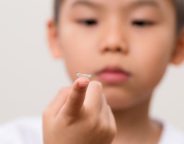 Child wearing a contact lens