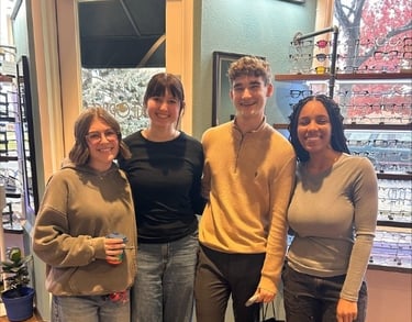 Team members from Edge Optics Fort Collins smiling inside the office