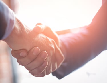 Partnership handshake representing Vital Talents collaboration with Saudi Hospitals.