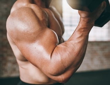 a man with a dumbbell in his hand