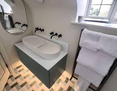a bathroom with a bathtub and a mirror a bathroom with a shower and a toilet fitted by pbp services 