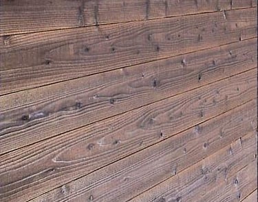 Rustic dark brown horizontal wood planks texture with natural grain and knots for background.