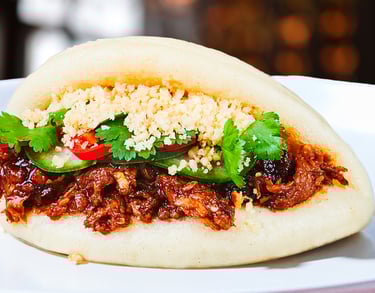 korean vegan meat, hazelnuts, cucumber, coriander stuffed in bao buns