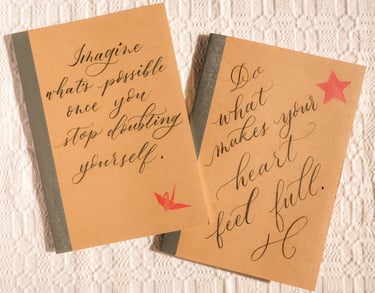 Personalized journals with handwritten calligraphy for an activation in NYC by Handwritten by Belle.