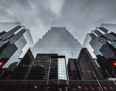 a city street scene with a tall building in the background