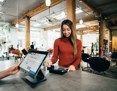 a woman is standing in front of a counter top