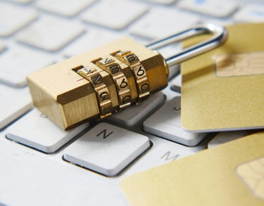 a padlocked and a credit card on keyboard