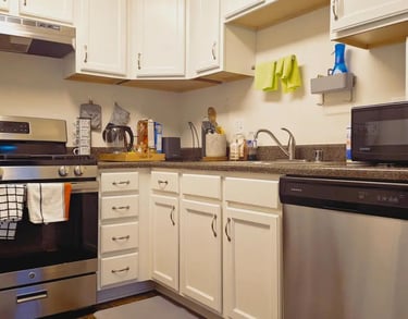 Modern kitchen featuring stainless steel appliances and in-unit laundry at Apartment for Rent Anacos