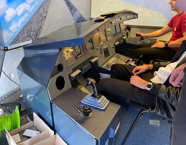 two people sitting in a plane