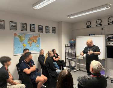 a group of people sitting in a room