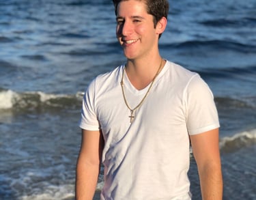 Rene Aviles in a white shirt and black pants