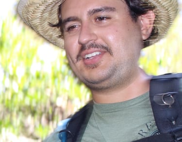 Gabriel Alvarez with a hat and a backpacker