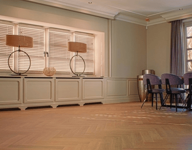 a room with a table and chairs and a table