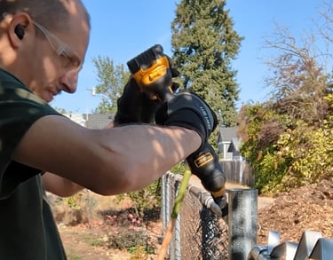 Cyd installing a fence gate