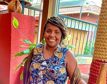 Chinwe O., founder of Bonya Books and retired reading specialist, smiling warmly