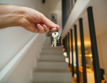 a person holding a keychaik with a keychaik