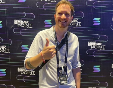 Unicris giving a thumbs up at the Solana Breakpoint 2024 crypto conference.