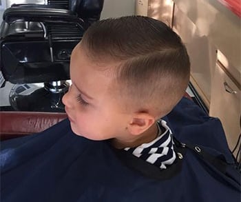 A young boy haircut at Main Street Barber