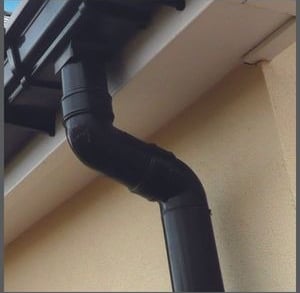 Roofing Specialist Yorkshire. Guttering and downpipes on the side of a house.