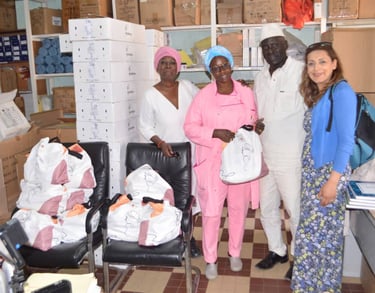 a group of people standing around a room with boxes of boxes
