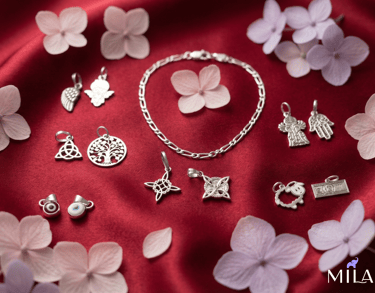 a bunch of jewelry on a red cloth