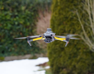 Professional DJI Mavic 3 thermal drone with RTK module hovering outdoors for aerial surveying.