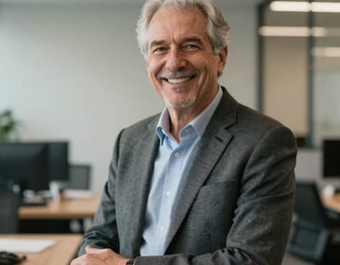 A professional portrait of a senior insurance advisor in a modern US office, dressed in business casual attire, smiling warmly to convey trust and reliability.
