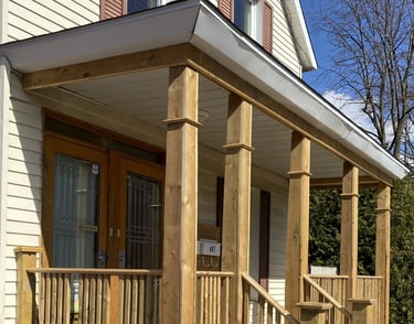 a porch with a wooden porch and a wooden porch
