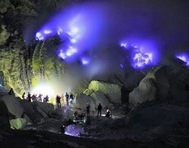 a group of people standing in front of blue flames