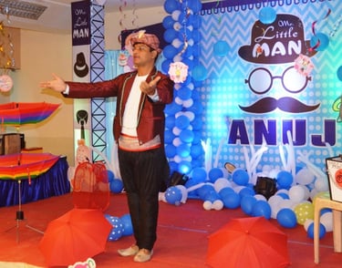 a man in a red jacket and a woman in a red jacket Magic Show