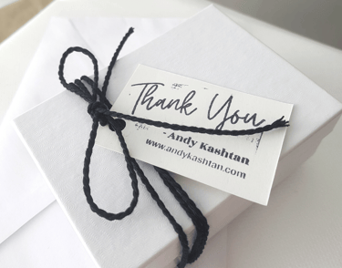 a thank card with a thank card attached to it