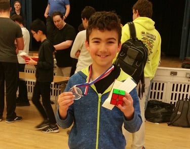 James Alonso holding up his first medal at a competition