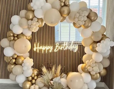 a birthday party with balloons and balloons