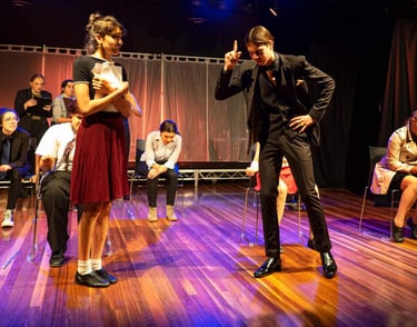 a man and woman in a stage setting