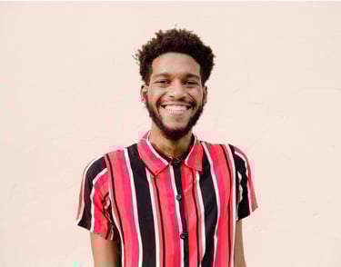 a man with a beard and a striped shirt