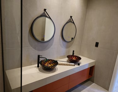 Expert plumber upgrading bathroom fixtures in UAE home with modern faucets and sinks